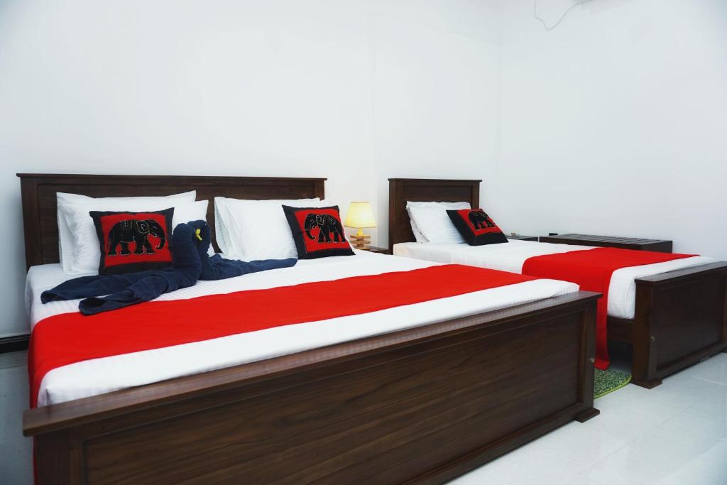Postel nebo postele na pokoji v ubytování Sashini Homestay