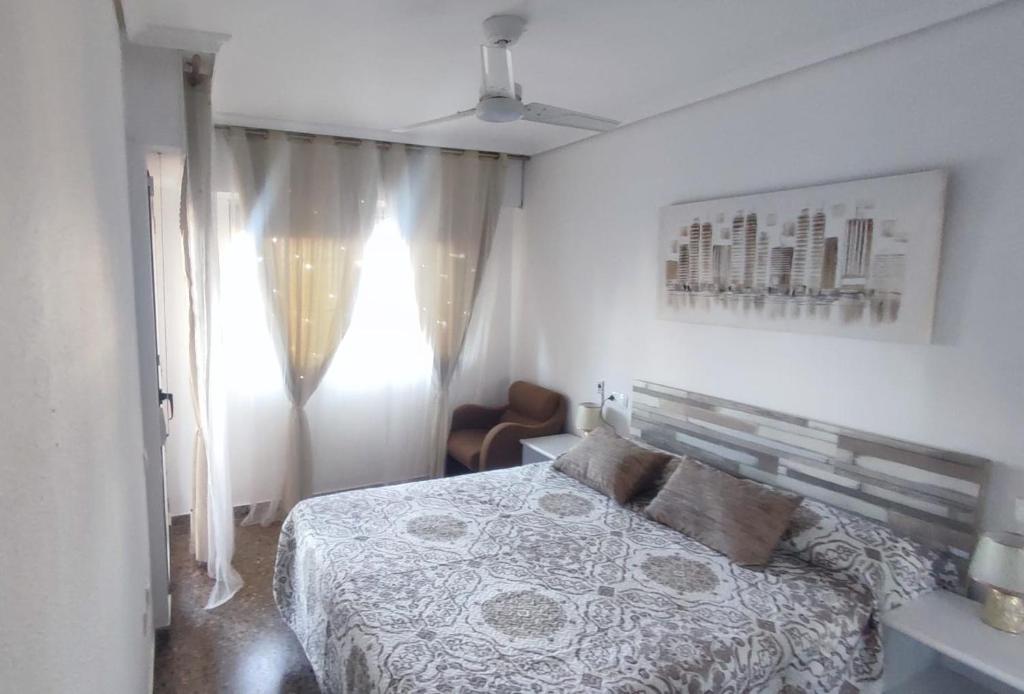 Ένα ή περισσότερα κρεβάτια σε δωμάτιο στο Casa Emma Vinaròs