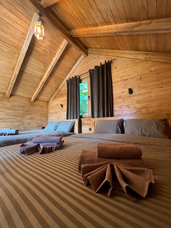 Ένα ή περισσότερα κρεβάτια σε δωμάτιο στο Cottages Serdar