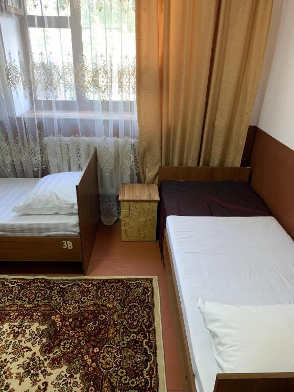 Postel nebo postele na pokoji v ubytování Bozui Hostel