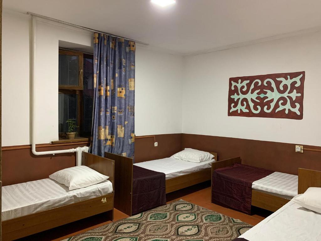 Postel nebo postele na pokoji v ubytování Bozui Hostel