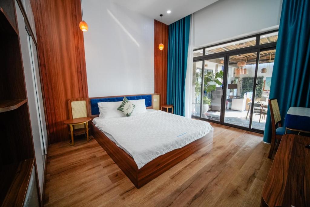 Postel nebo postele na pokoji v ubytování Coto Center Homestay
