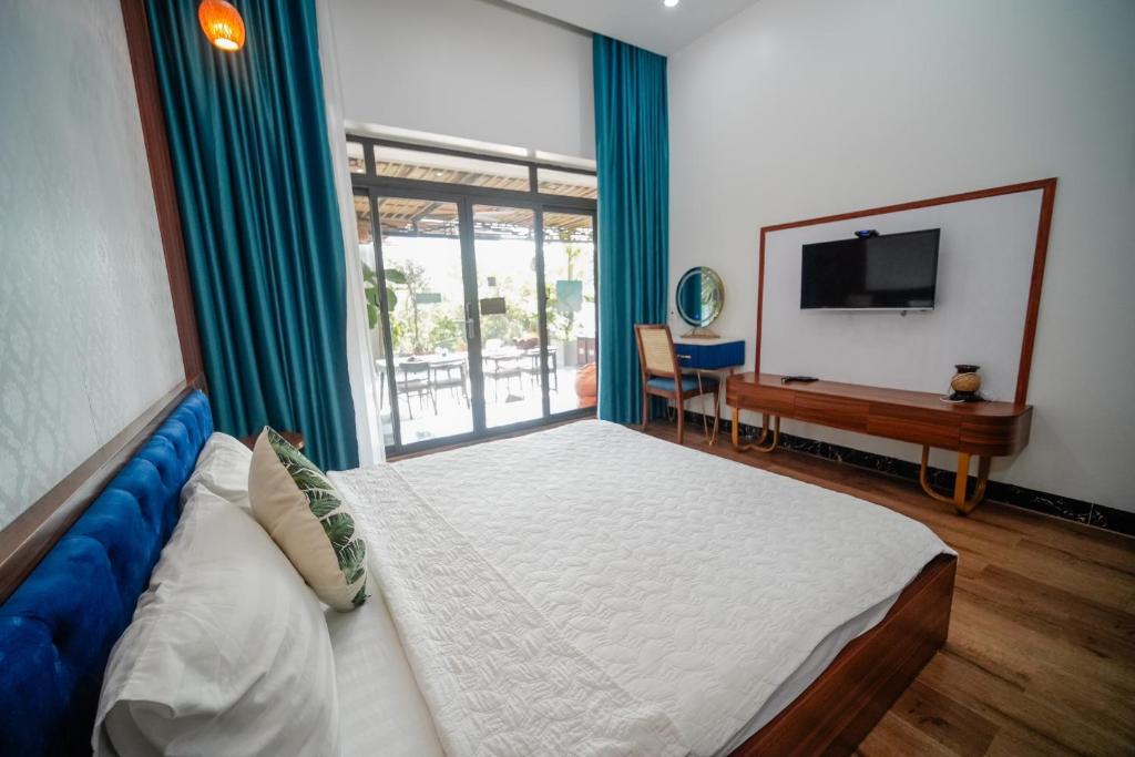 Postel nebo postele na pokoji v ubytování Coto Center Homestay