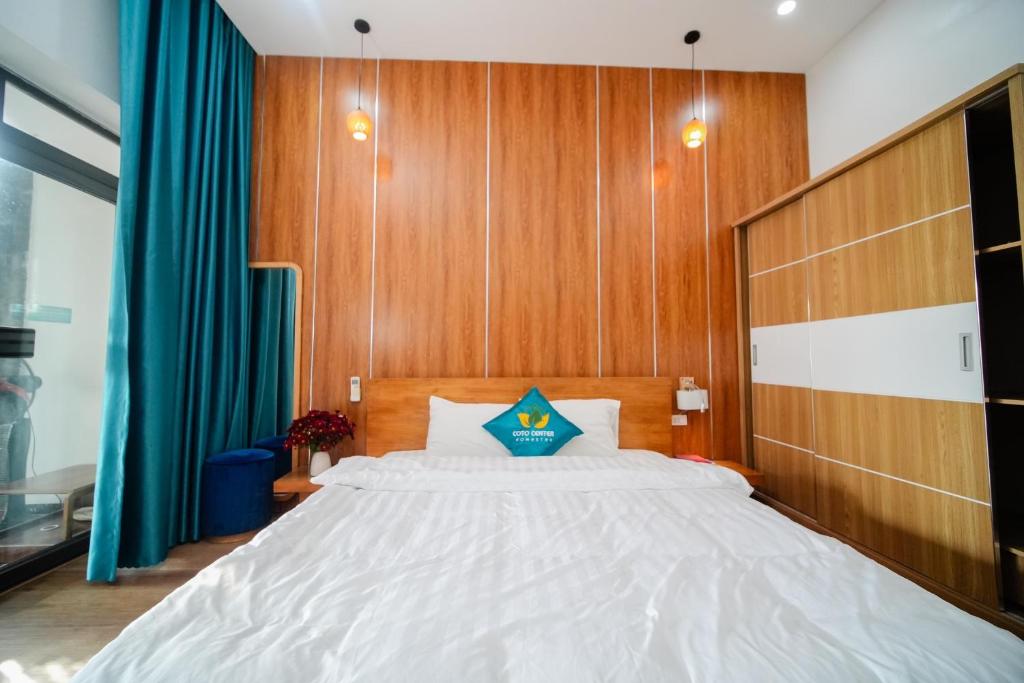 Postel nebo postele na pokoji v ubytování Coto Center Homestay