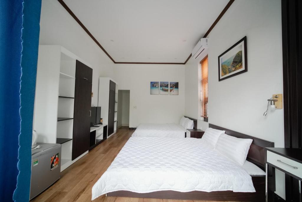 Postel nebo postele na pokoji v ubytování Coto Center Homestay