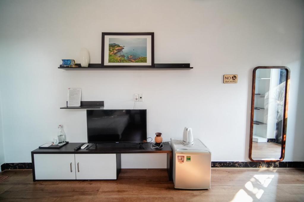 TV a/nebo společenská místnost v ubytování Coto Center Homestay