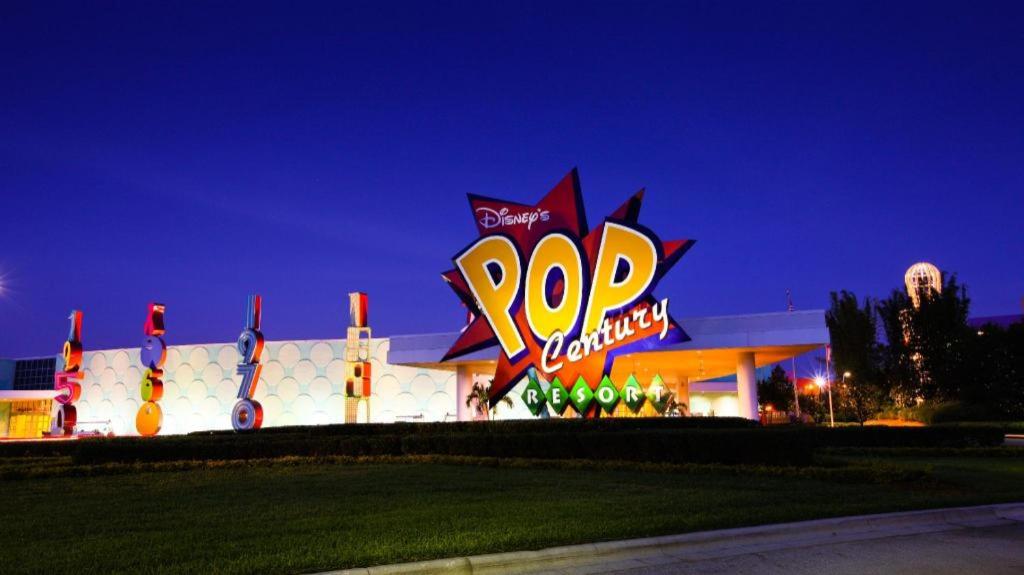 a popeyes sign in front of a building at night at Disney's Pop Century Resort in Orlando