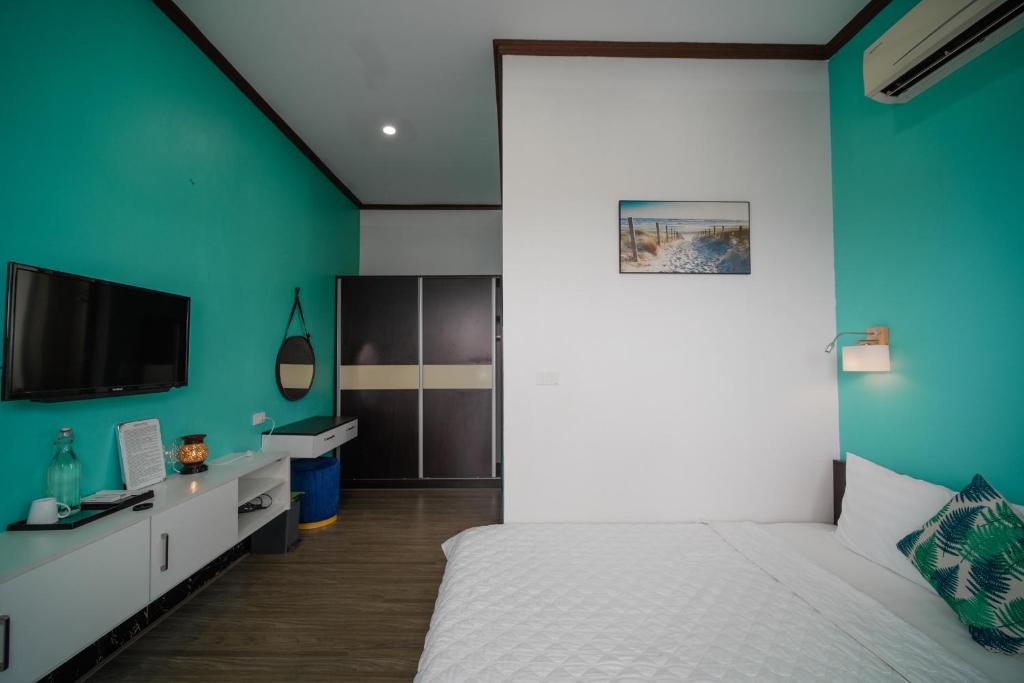 Postel nebo postele na pokoji v ubytování Coto Center Homestay