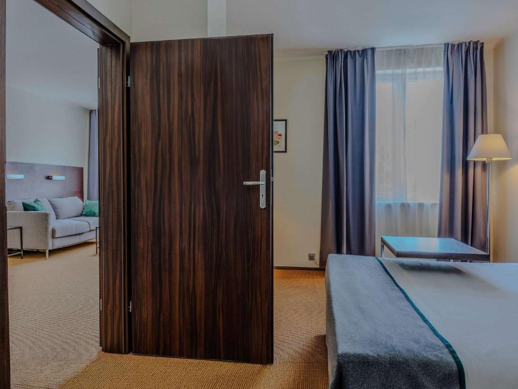 Posteľ alebo postele v izbe v ubytovaní Mercure Warszawa Airport