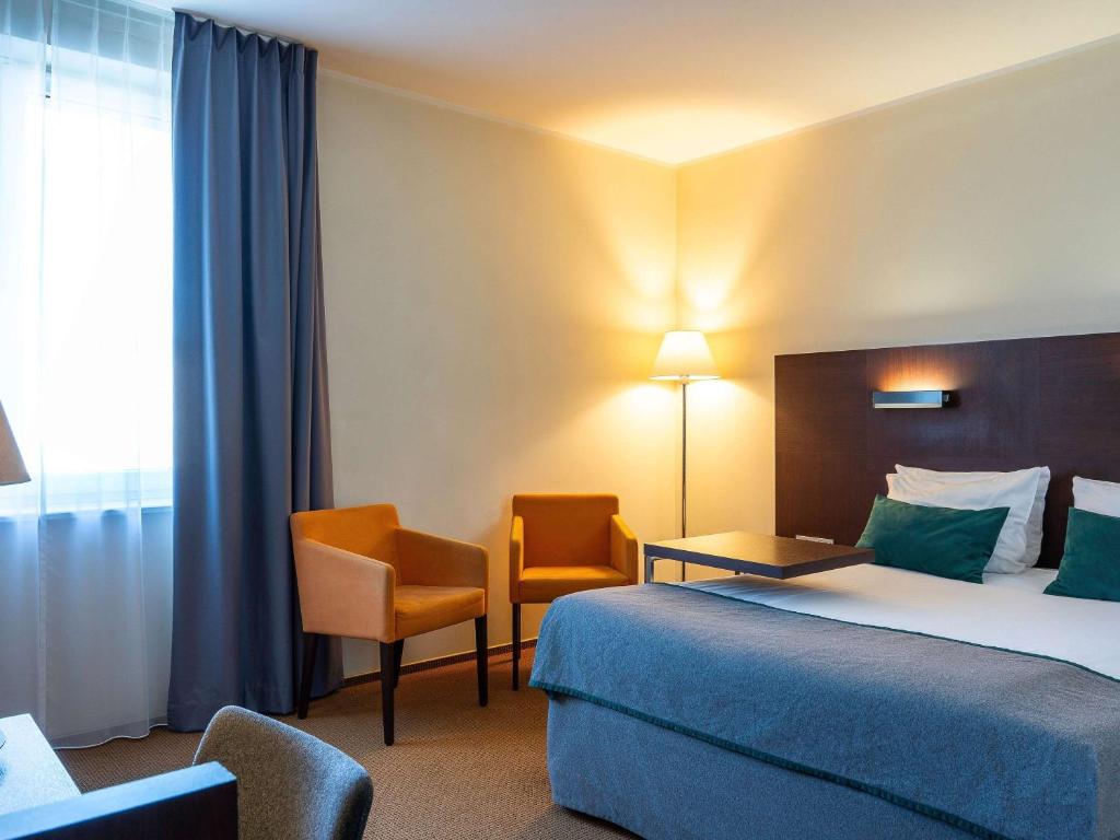 Posteľ alebo postele v izbe v ubytovaní Mercure Warszawa Airport