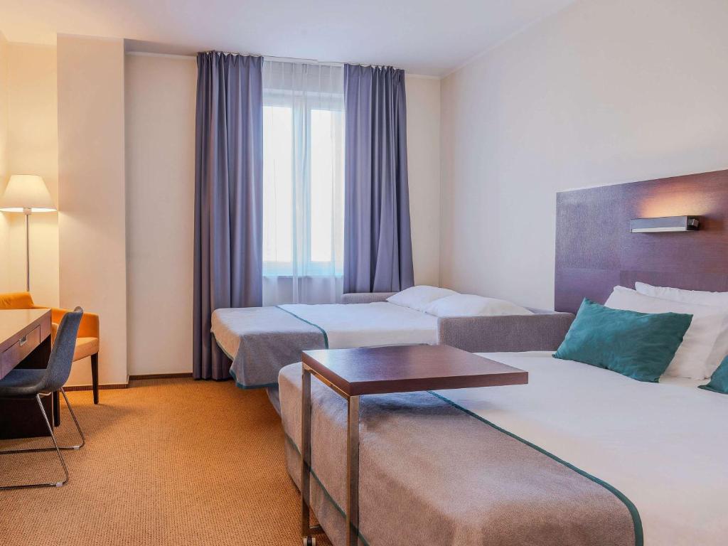 Posteľ alebo postele v izbe v ubytovaní Mercure Warszawa Airport