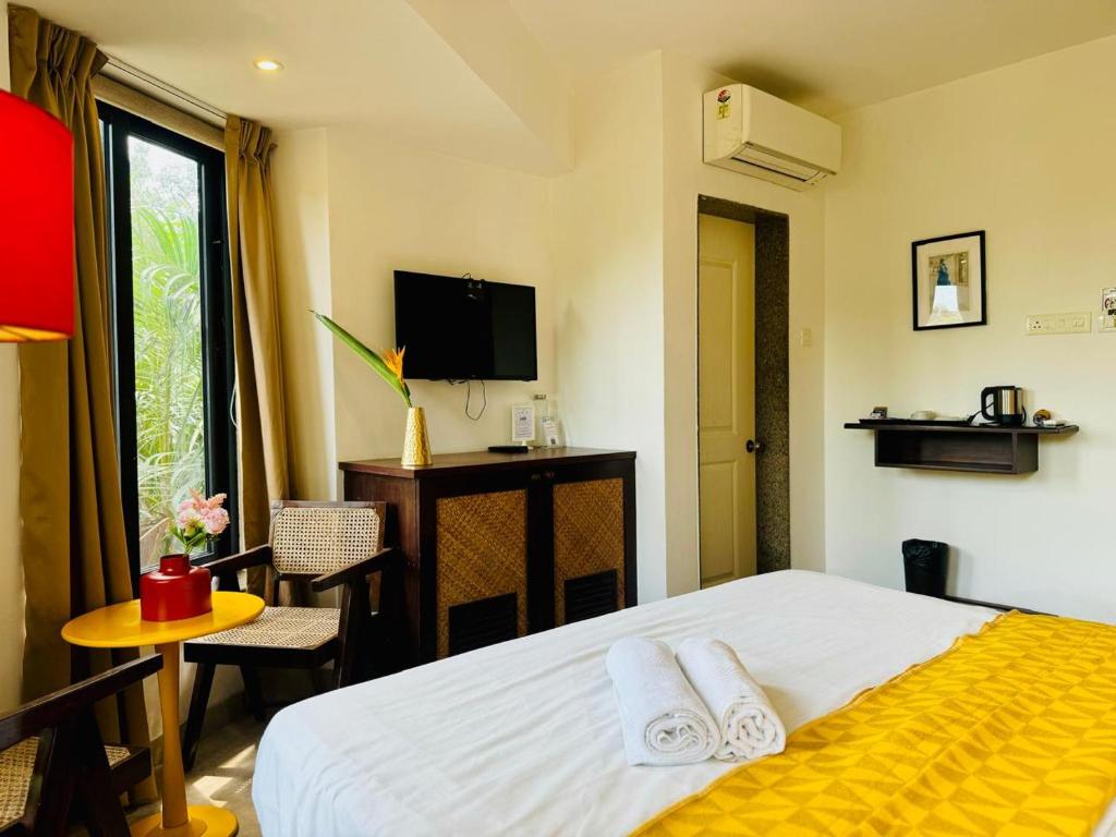 TV a/nebo společenská místnost v ubytování HALF Hotel, Calangute