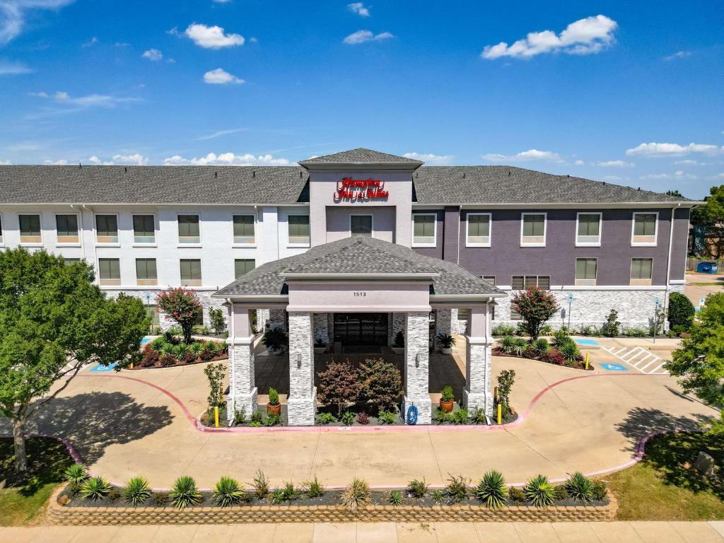 a rendering of the front of a hotel at Hampton Inn & Suites Denton in Denton
