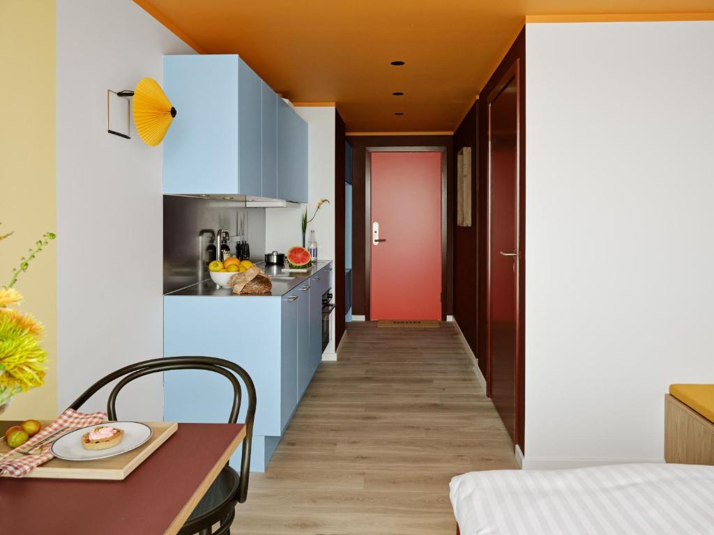 Kuchyň nebo kuchyňský kout v ubytování Dahei Apartment Hotel