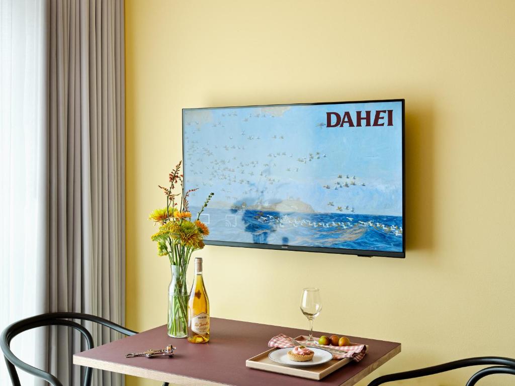TV a/nebo společenská místnost v ubytování Dahei Apartment Hotel