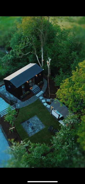 an aerial view of a house in the woods at Riverside Retreat in Monaghan