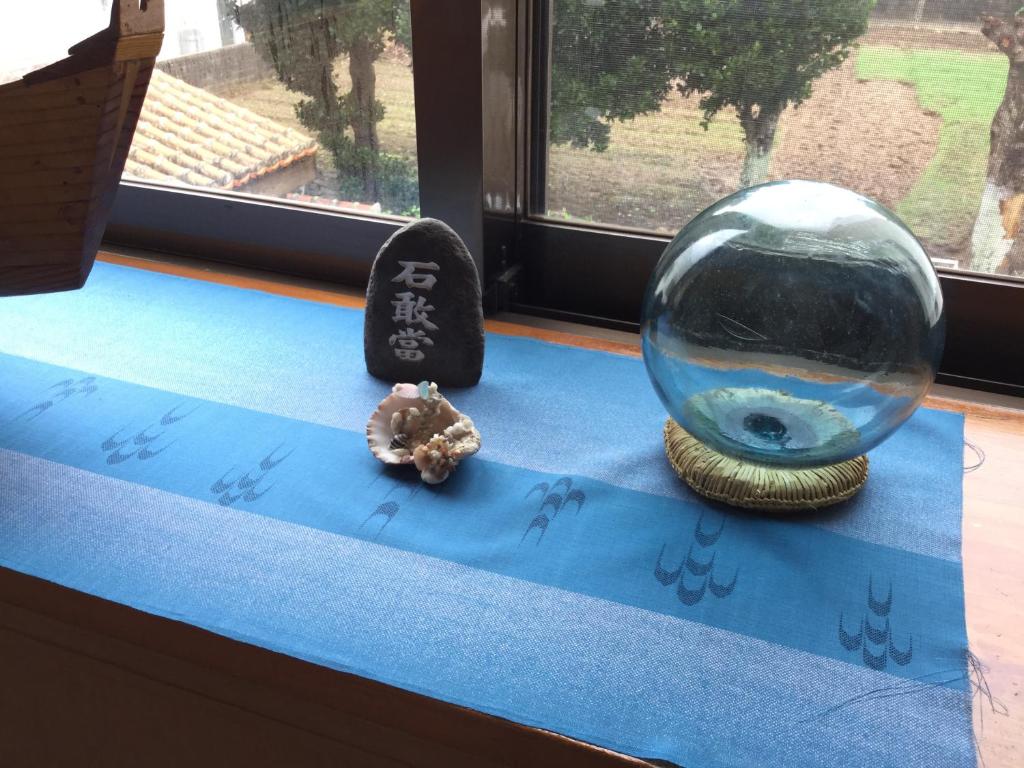 a window sill with a bowl and a fish in it at Joya in Ishigaki Island