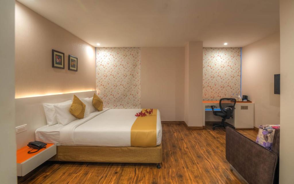 Postel nebo postele na pokoji v ubytování Mango Hotels Prangan