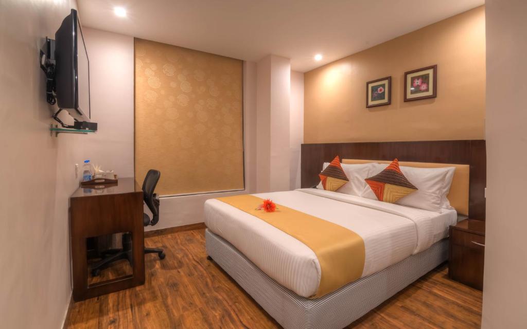 Postel nebo postele na pokoji v ubytování Mango Hotels Prangan