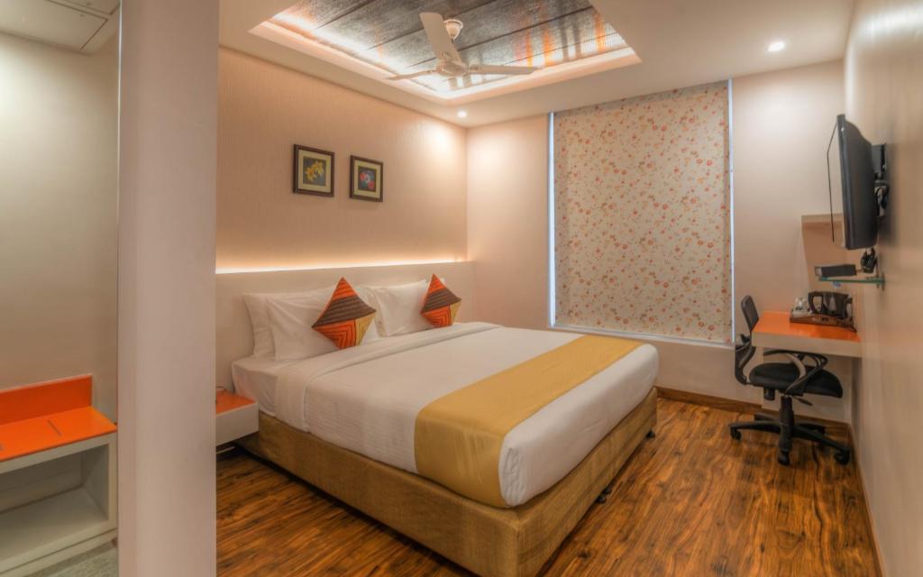 Postel nebo postele na pokoji v ubytování Mango Hotels Prangan