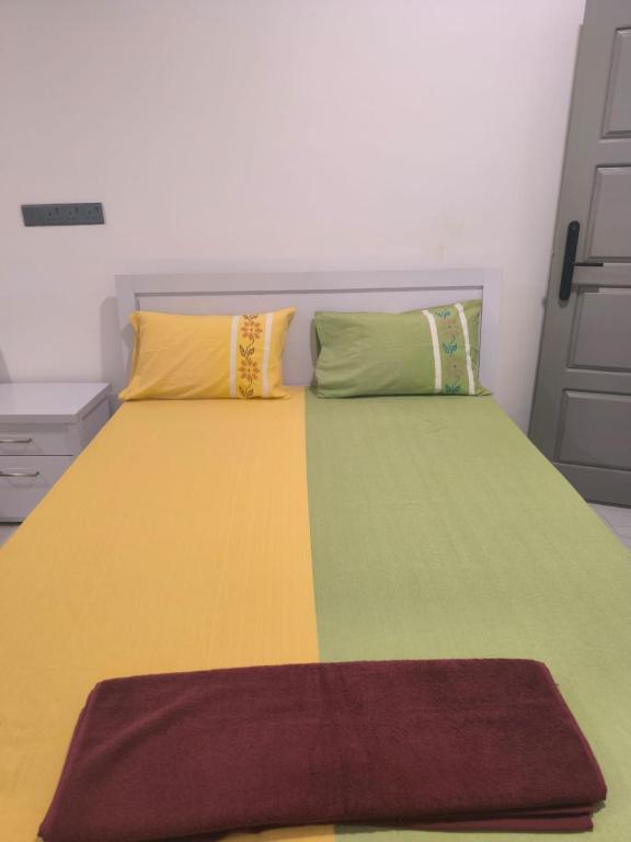 Postel nebo postele na pokoji v ubytování Trinco Caritas Guest Villa