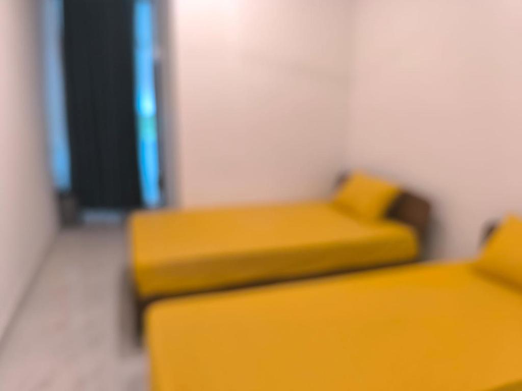 Postel nebo postele na pokoji v ubytování Trinco Caritas Guest Villa