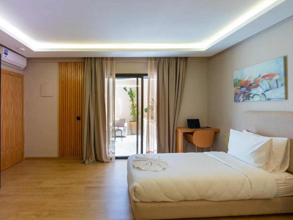Postel nebo postele na pokoji v ubytování Unico Hotel Maarif