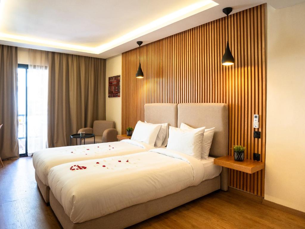 Postel nebo postele na pokoji v ubytování Unico Hotel Maarif