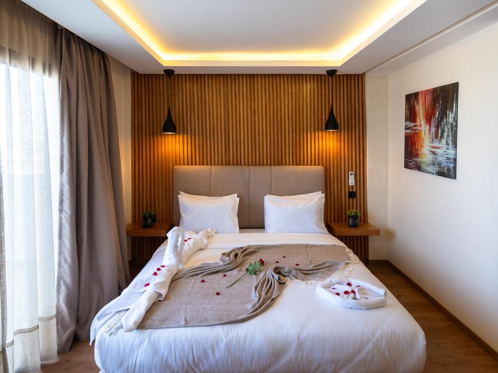 Postel nebo postele na pokoji v ubytování Unico Hotel Maarif