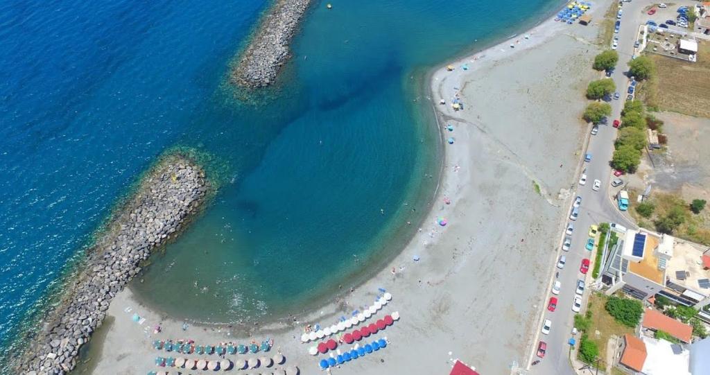an aerial view of a beach and the ocean at Kalamata Garden Haven - Escape Amidst Greenery in Kalamata
