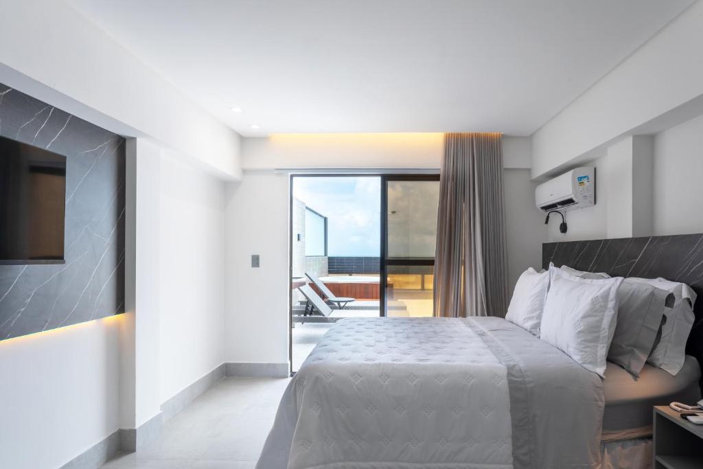 Cama ou camas em um quarto em Slaviero João Pessoa
