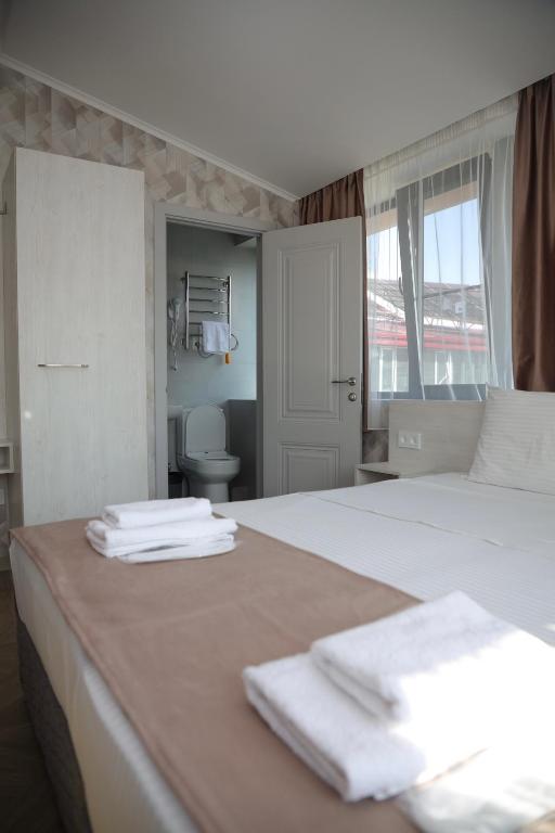 Postel nebo postele na pokoji v ubytování Chief Hotel