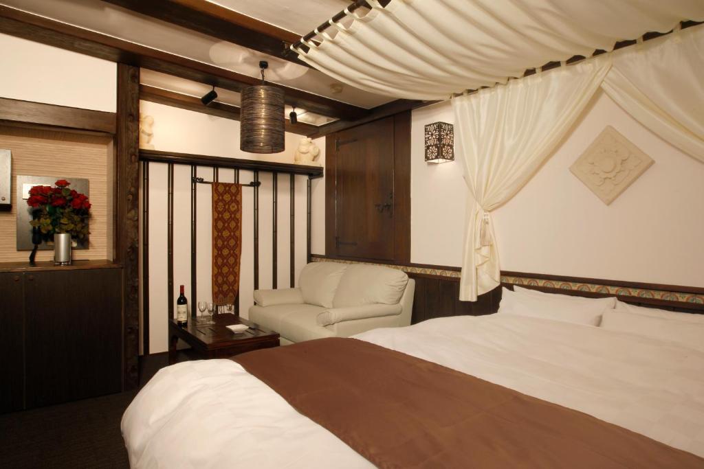 Ένα ή περισσότερα κρεβάτια σε δωμάτιο στο HOTEL K's ABA Adult Only