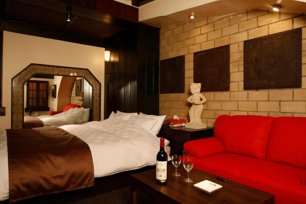 Ένα ή περισσότερα κρεβάτια σε δωμάτιο στο HOTEL K's ABA Adult Only