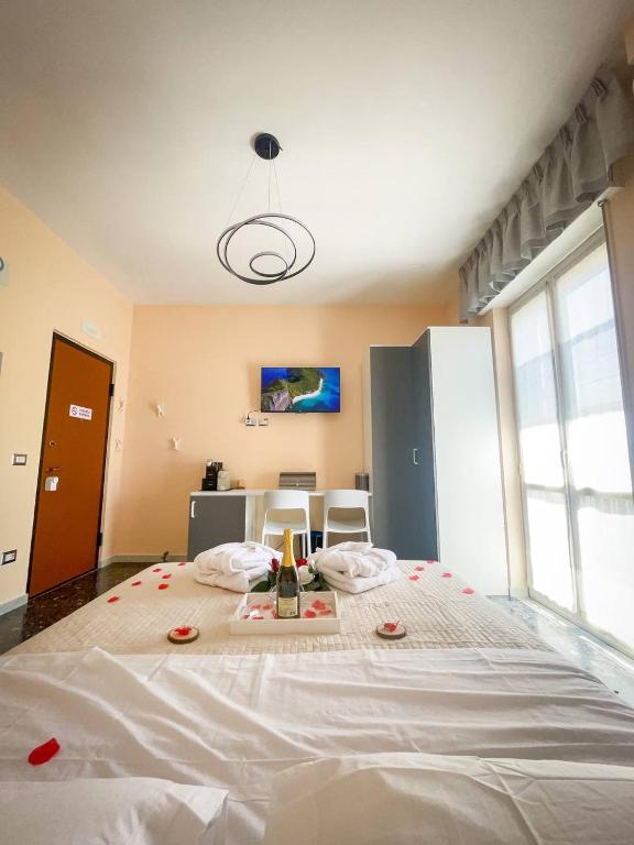 a bedroom with a large bed with red roses on it at B&B Comfort Room 93 in Benevento