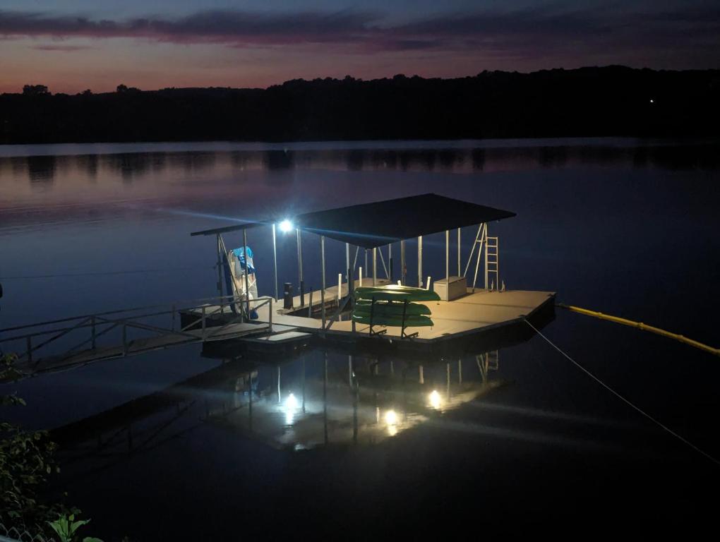 a dock in the middle of a lake at night at Makin MEMORIES: with Dock/Hot Tub/Cable Internet in Bremen