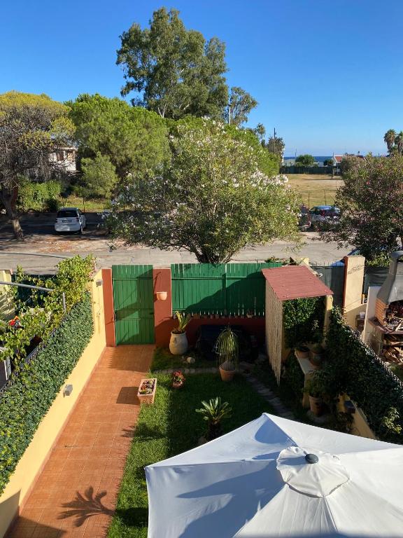 an overhead view of a yard with a fence at Casa Robi in Flumini di Quartu