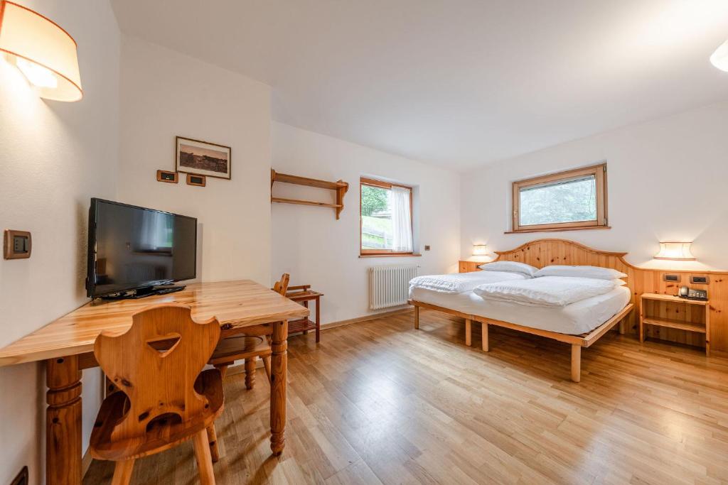 Postel nebo postele na pokoji v ubytování Hotel Vioz