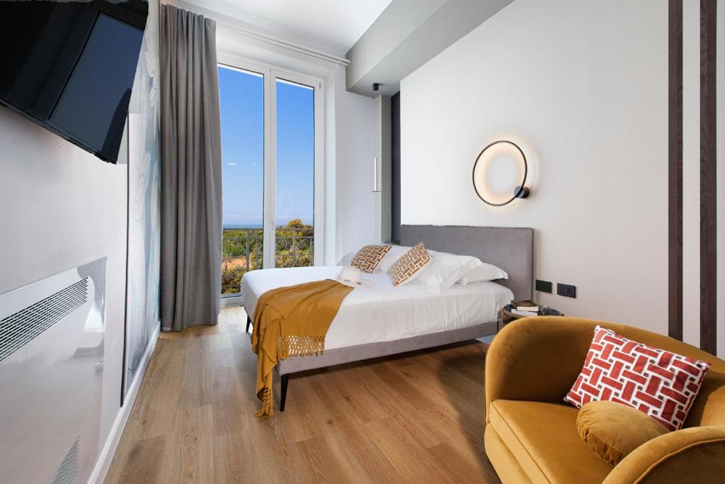 Postel nebo postele na pokoji v ubytování Vesuvius Palace Aparthotel