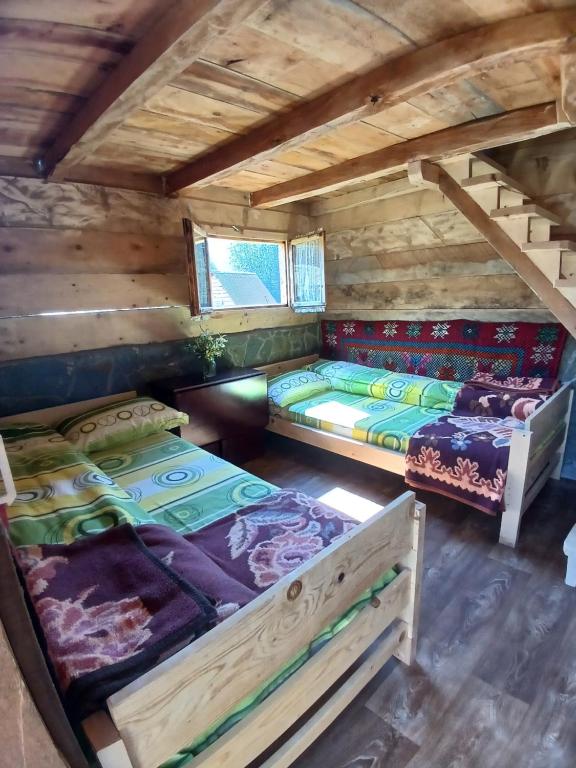 a room with three beds in a log cabin at Dulović - KATUN POTOCI in Kolašin