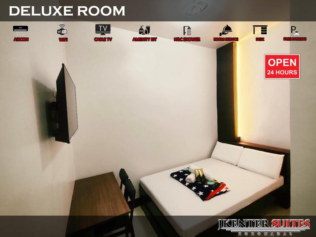 Postel nebo postele na pokoji v ubytování Jkenter Suites