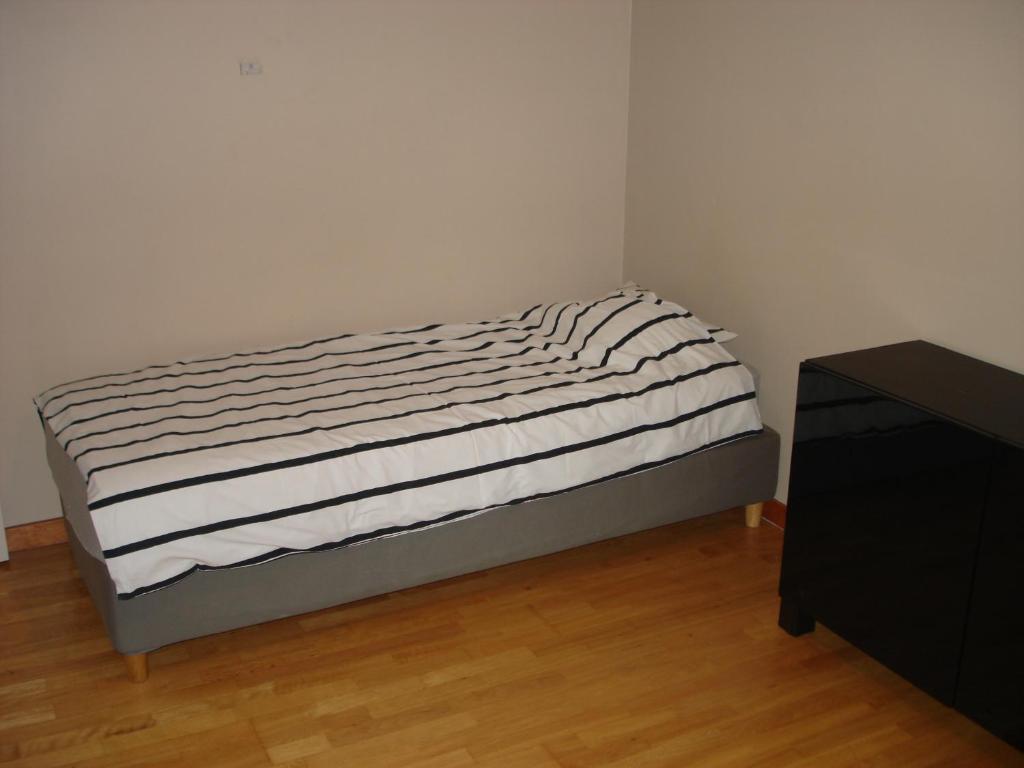 Postel nebo postele na pokoji v ubytování Appartement Courcelles