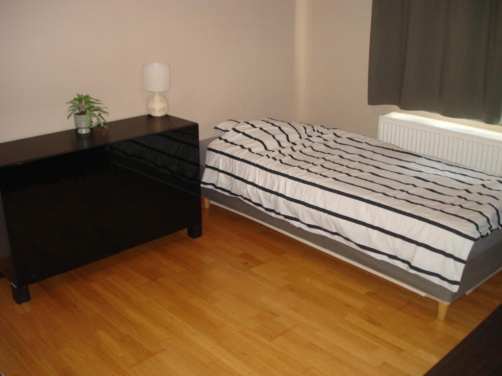 Postel nebo postele na pokoji v ubytování Appartement Courcelles
