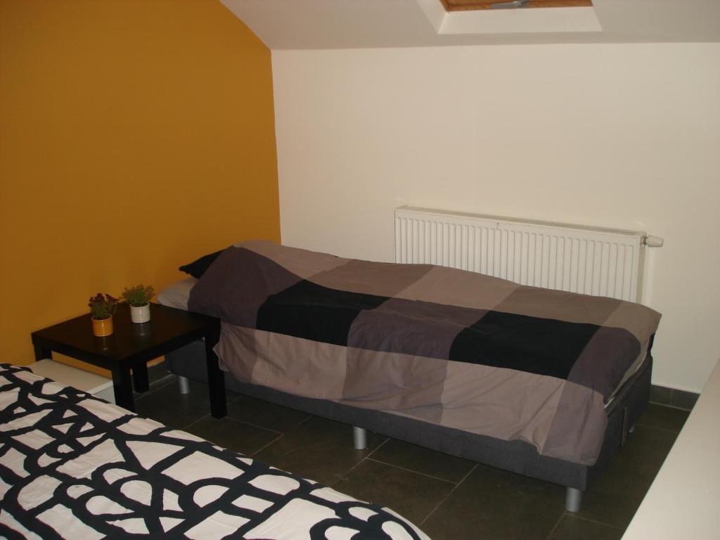 Postel nebo postele na pokoji v ubytování Appartement Courcelles