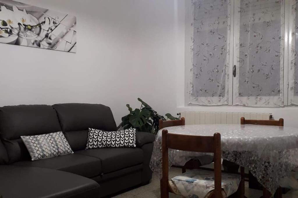 a living room with a couch and a table at Centralissimo Mi.Ma in Milano Marittima