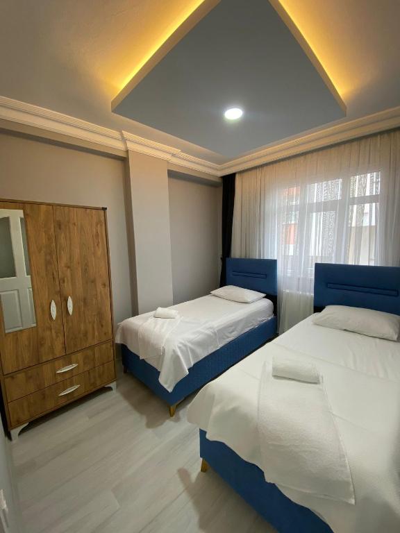 Postel nebo postele na pokoji v ubytování AYKA apart