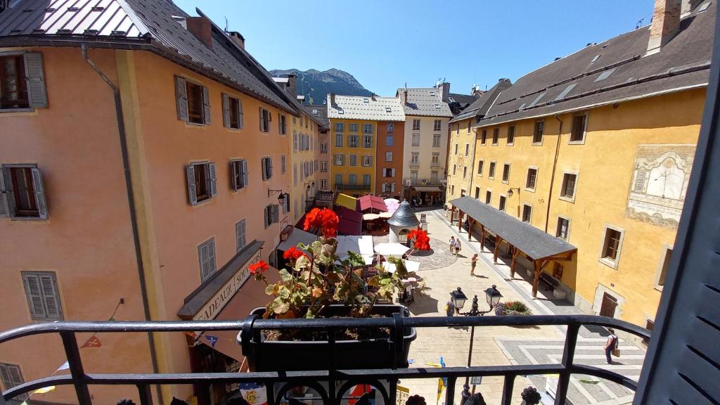 a view from a balcony of a city with buildings at Appartement de charme le 1707 au cœur de la cité Vauban in Briançon