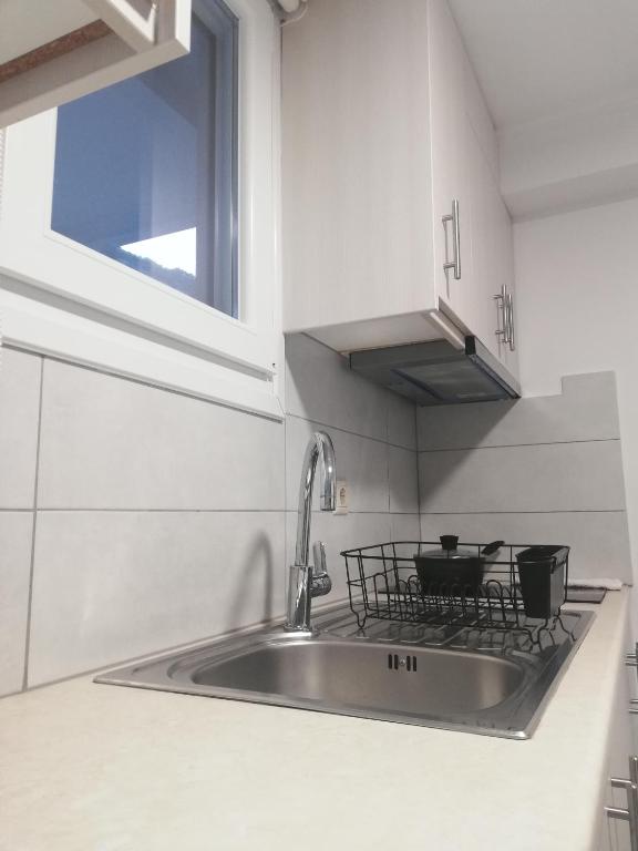 Kuchyň nebo kuchyňský kout v ubytování Andromeda Seaside Apartments
