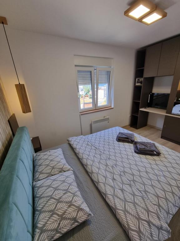 Postel nebo postele na pokoji v ubytování Apartman Mali Raj Zlatar
