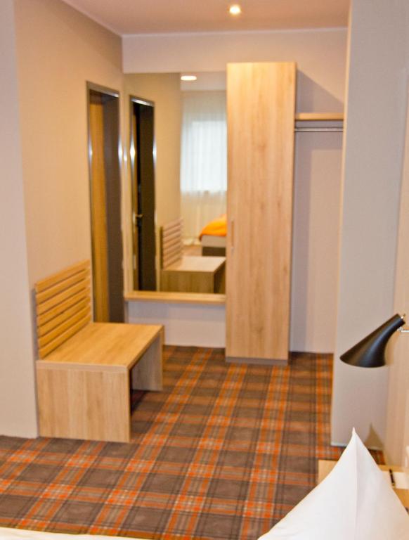 Postel nebo postele na pokoji v ubytování Hotel Alpha